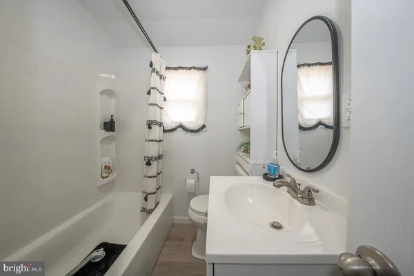a bed room with a bed and a large mirror
