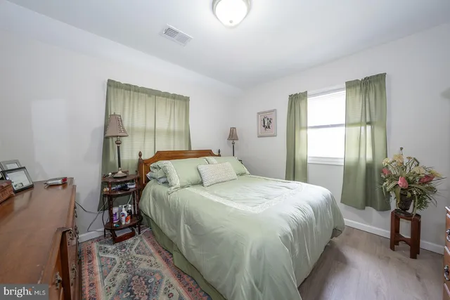 an aerial view of a house with a yard and lake view