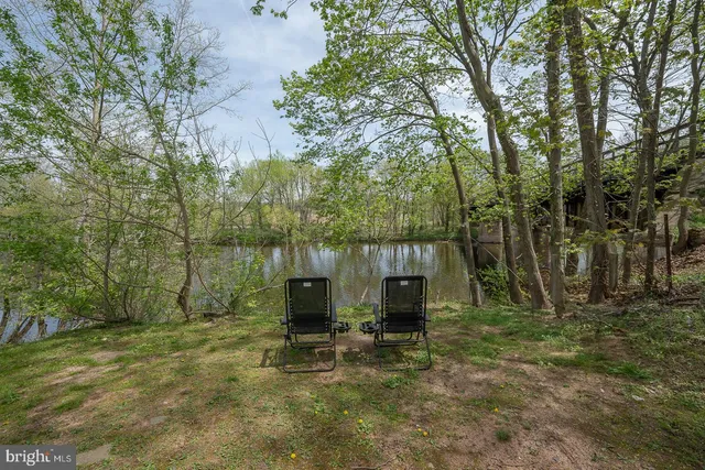 a view of a house with a yard and garage