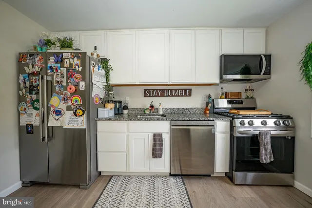 an aerial view of a houses with outdoor space and street view