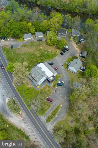 a living room with furniture a window and a flat screen tv