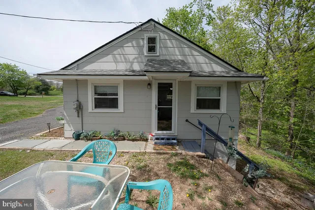 a view of gym equipment with wooden floor