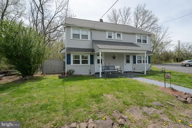 a kitchen with granite countertop stainless steel appliances a sink stove and refrigerator