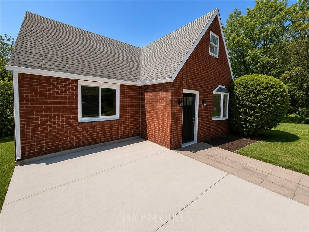 3079 Mt Troy Road Pittsburgh, PA 15212 - Photo 2 of 30 a front view of a house with a yard and garage