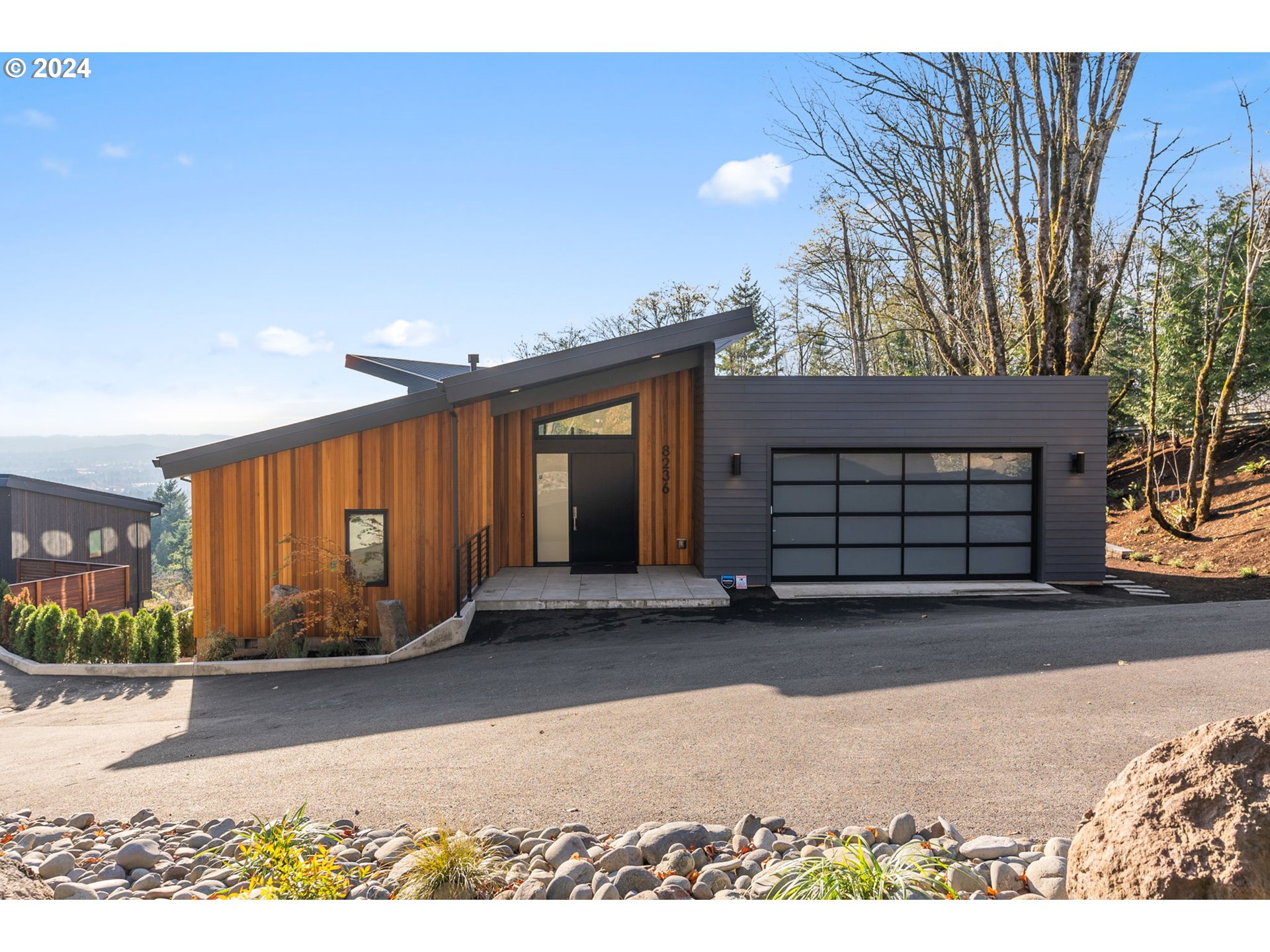 8236 Northwest Thompson Road Portland, OR 97229 - Photo 4 of 48 a view of a house with a garage