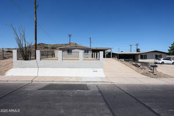 a view of a patio with table and chairs