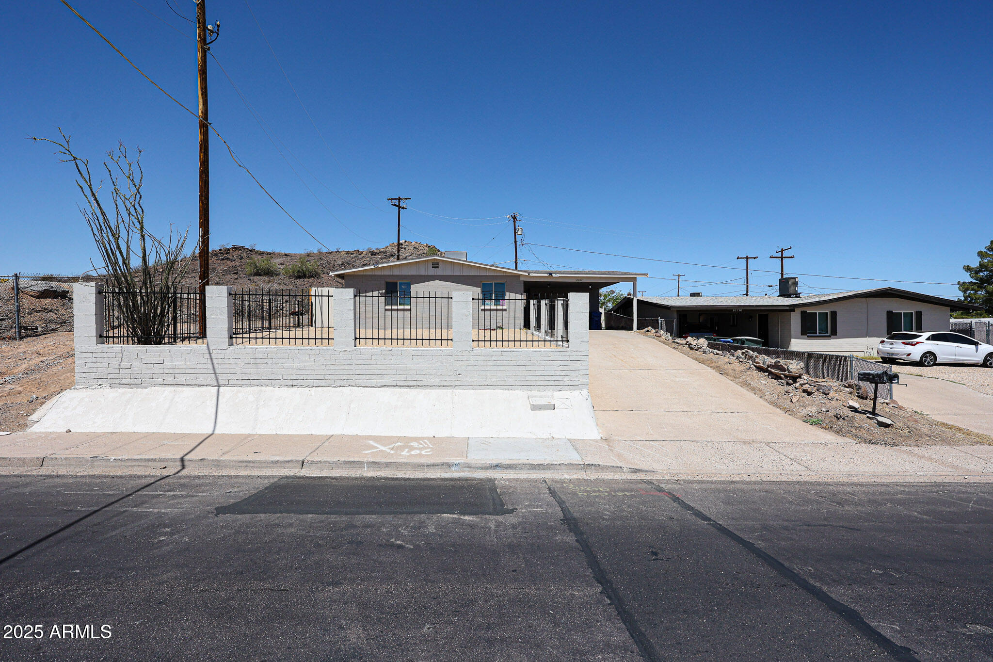 a view of a patio with table and chairs