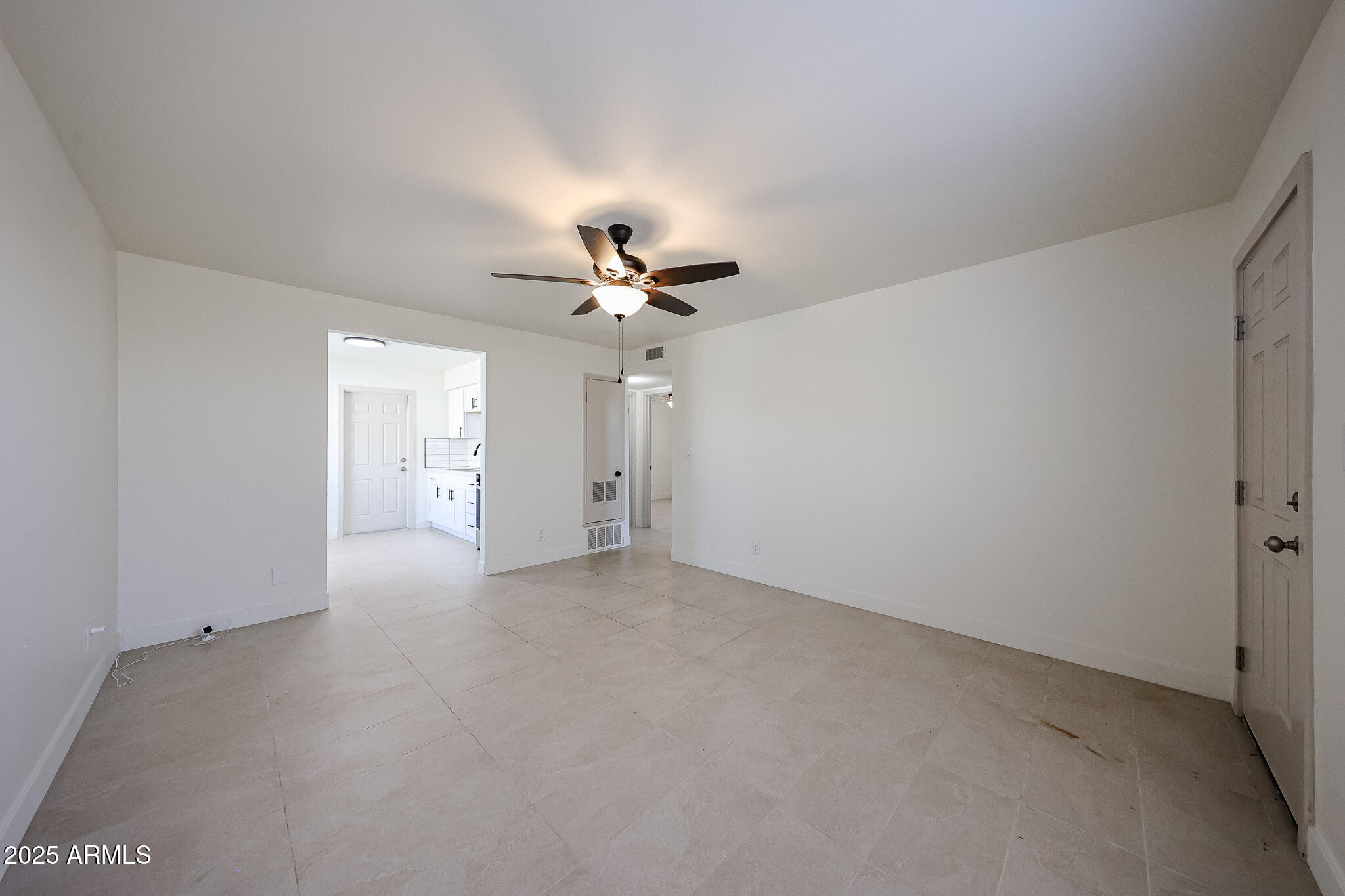 10202 North 15th Avenue, Unit 2 Phoenix, AZ 85021 - Photo 22 of 34 a view of a livingroom with a chandelier fan