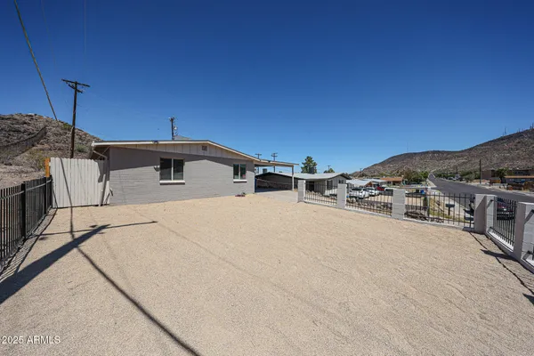 a view of a terrace with a table and chairs