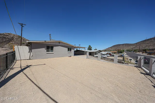 a view of a terrace with a table and chairs