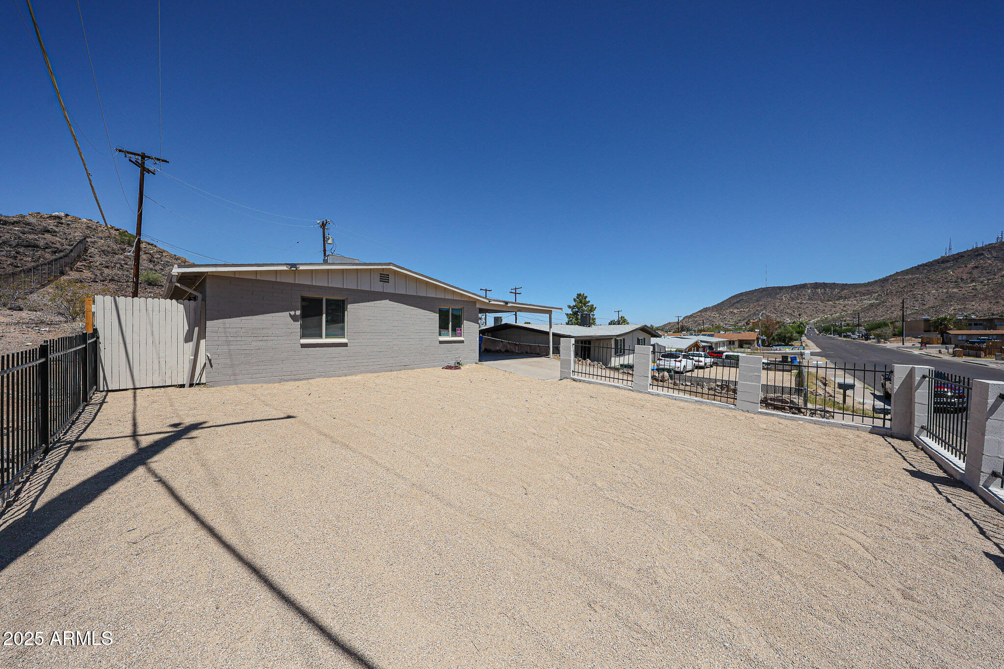 10202 North 15th Avenue, Unit 2 Phoenix, AZ 85021 - Photo 4 of 34 a view of a house with a backyard