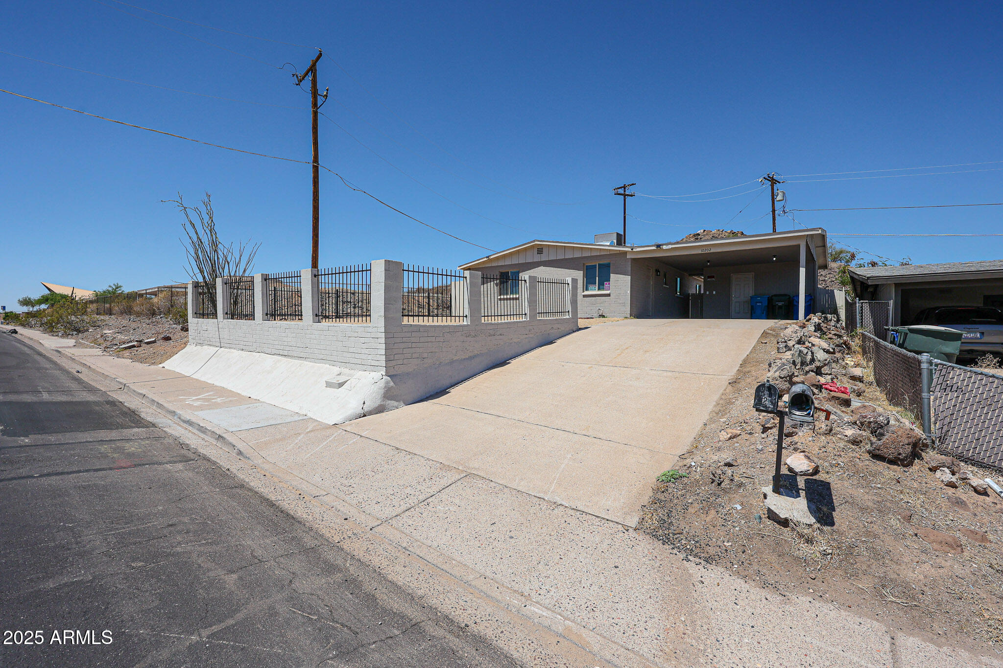 10202 North 15th Avenue, Unit 2 Phoenix, AZ 85021 - Photo 5 of 34 a view of a terrace with a table and chairs