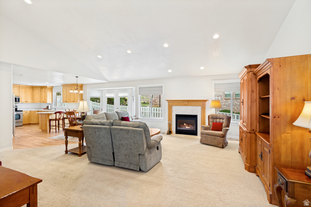 298 North Canyon Road Bountiful, UT 84010 - Photo 11 of 57 Expansive living area featuring a fireplace with a wood mantle, recessed lighting, and a bay window