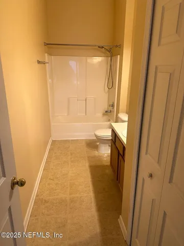 a bathroom with a tub and a shower