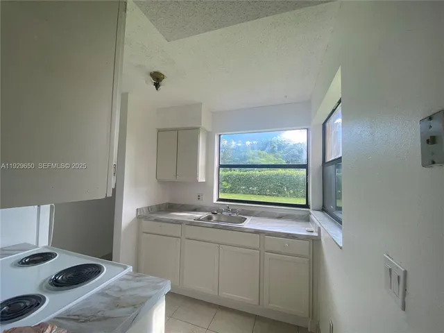 a bathroom with a sink and a window