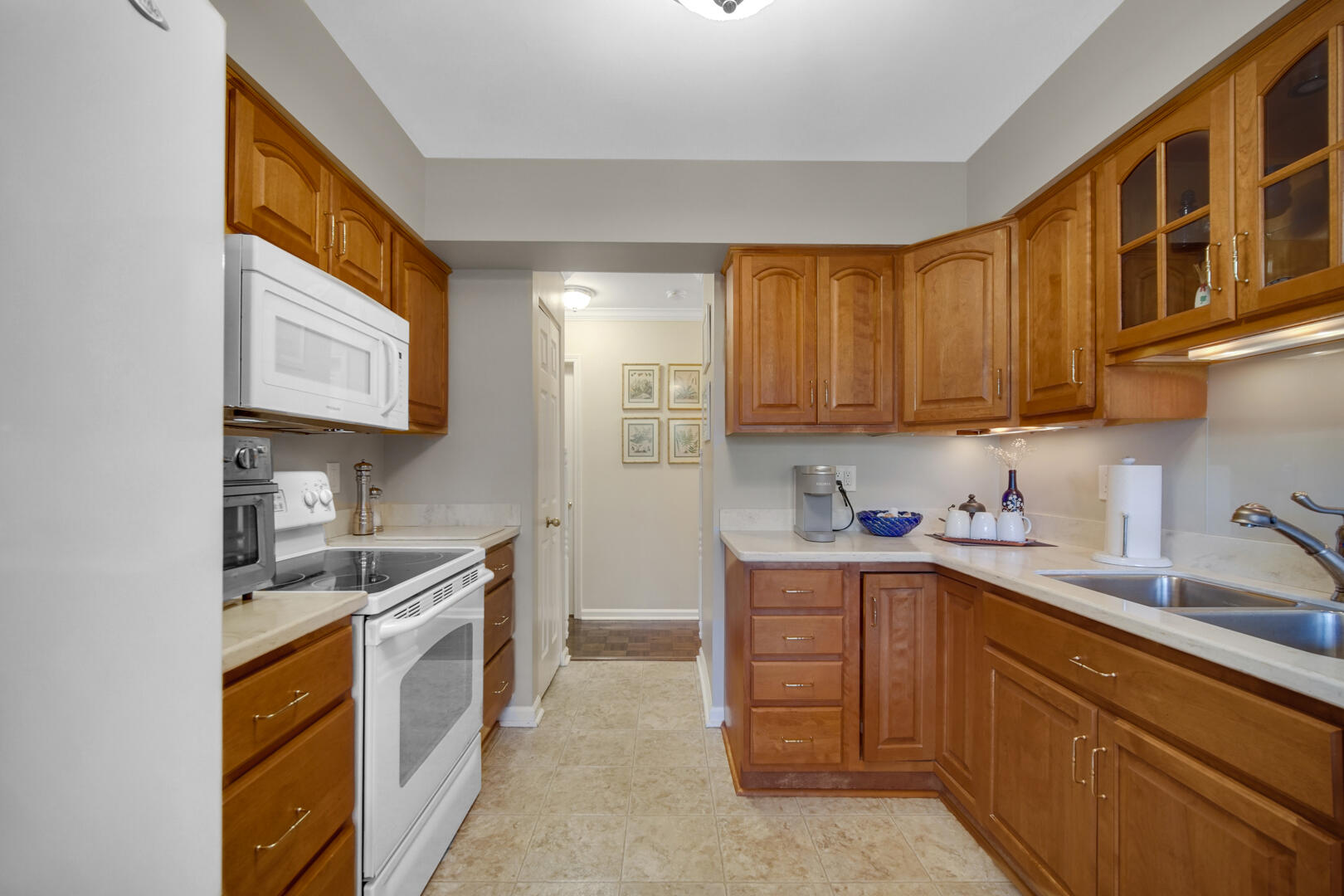 910 Ridge Road, Unit 405 Munster, IN 46321 - Photo 11 of 37 a kitchen with a sink cabinets and window