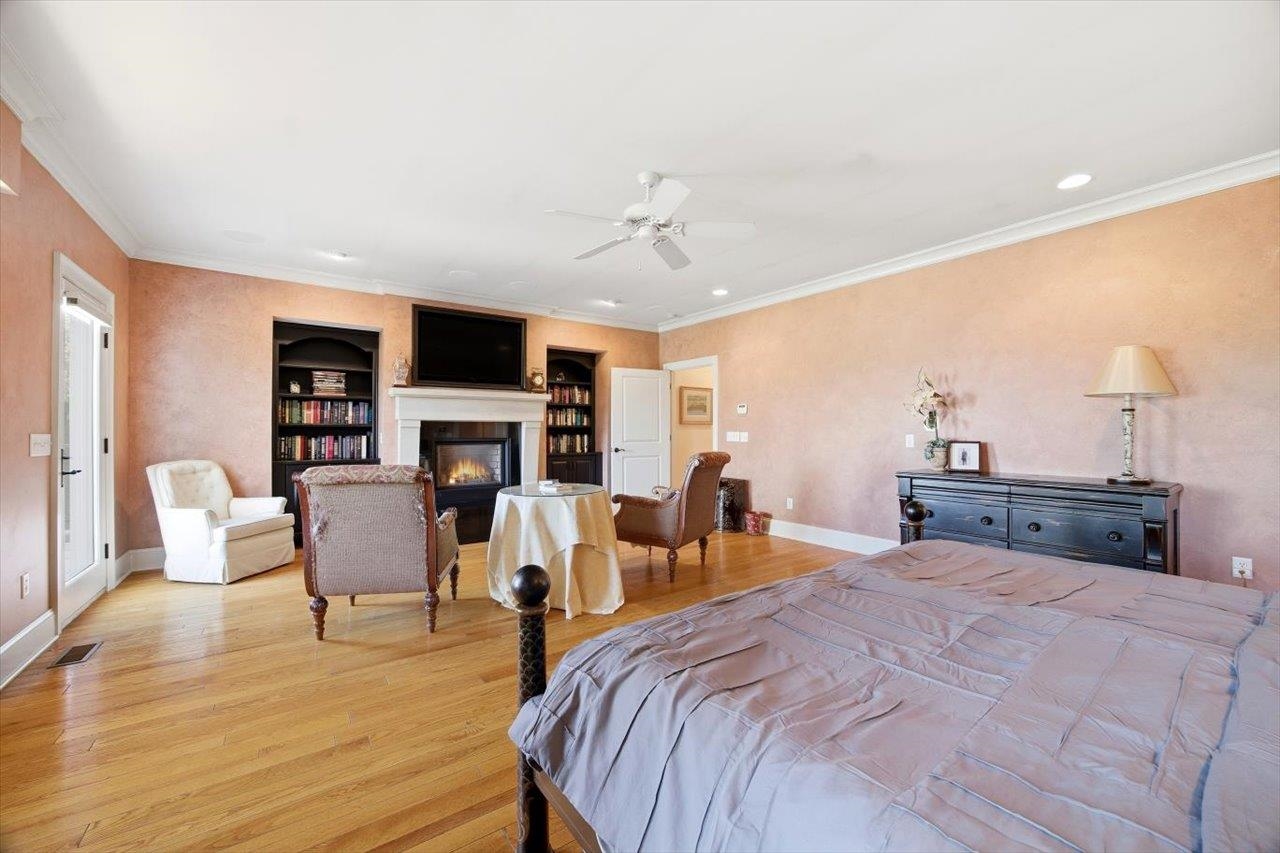 2223 Airport Road Bridgewater, VA 22812 - Photo 19 of 74 a bed room with furniture a fireplace and a flat screen tv