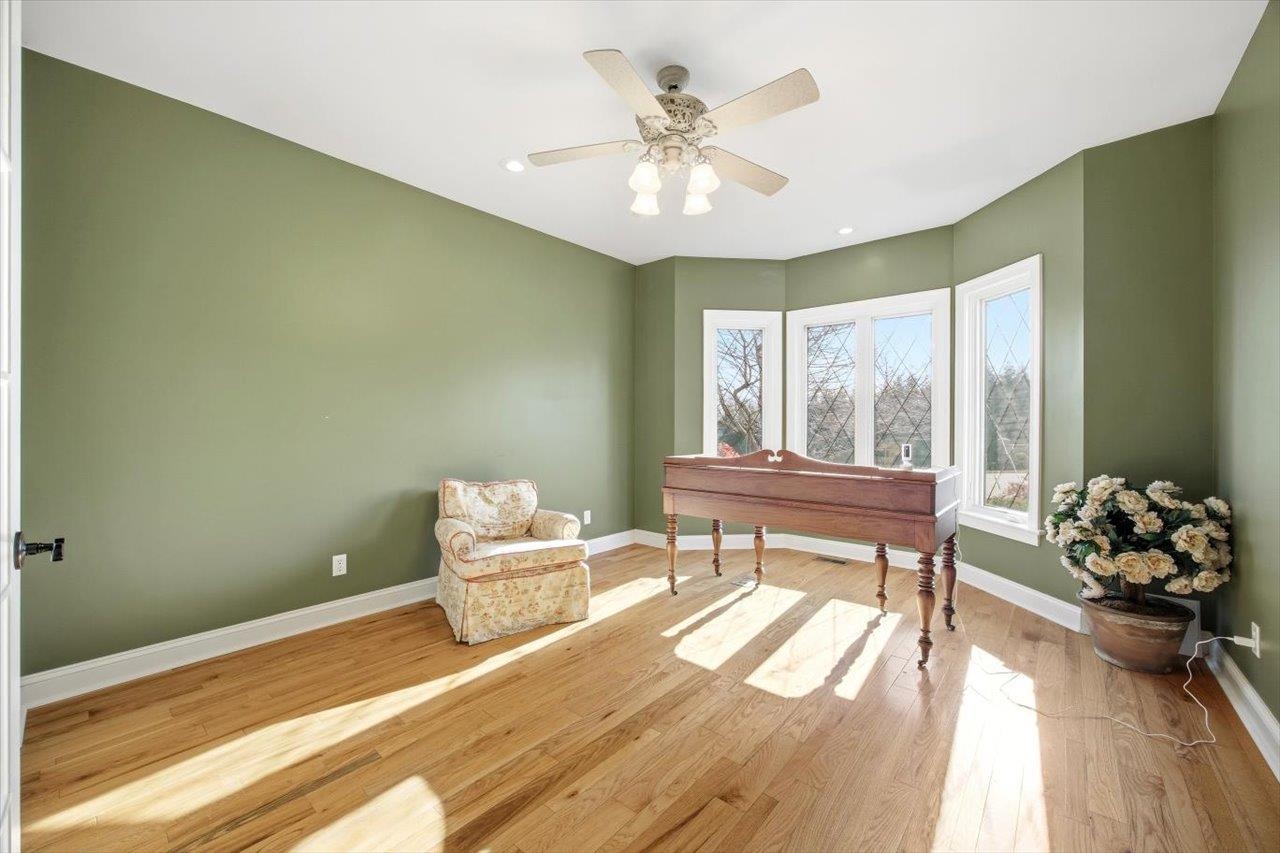 2223 Airport Road Bridgewater, VA 22812 - Photo 30 of 74 a bedroom with a bed and a chandelier