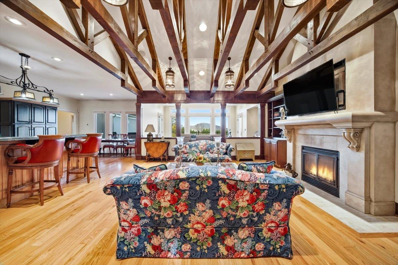 2223 Airport Road Bridgewater, VA 22812 - Photo 4 of 74 a living room with lots of furniture a fireplace and a flat screen tv