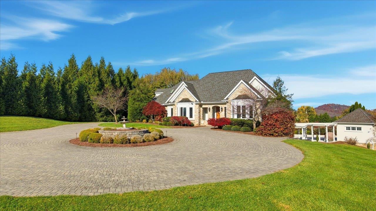 2223 Airport Road Bridgewater, VA 22812 - Photo 72 of 74 a front view of a house with a garden and trees