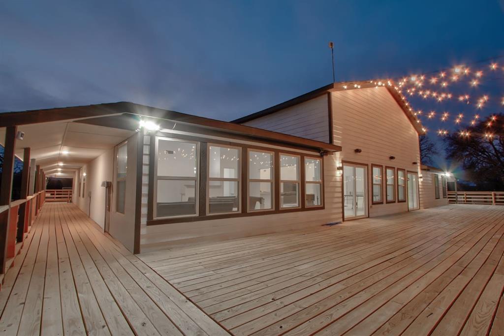550 County Road 297 Gainesville, TX 76240 - Photo 12 of 24 a view of a porch with wooden floor and fence