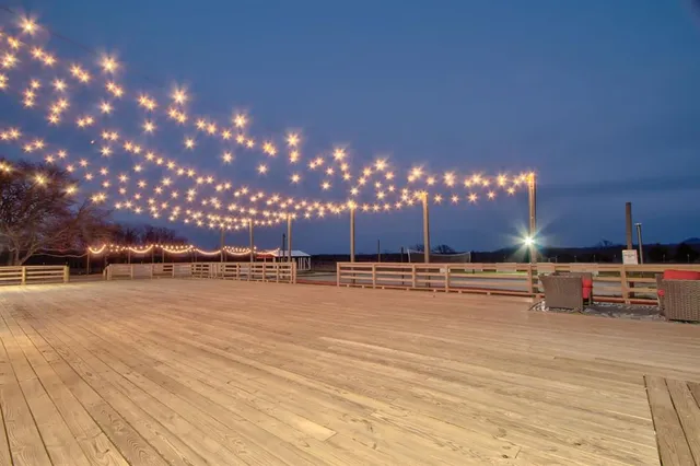 a front view of a house with a yard table and chairs