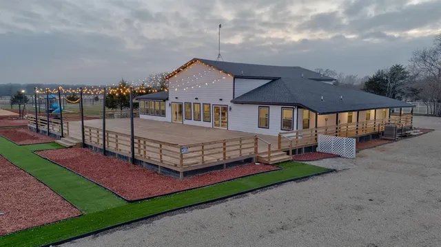 a view of a backyard with swimming pool