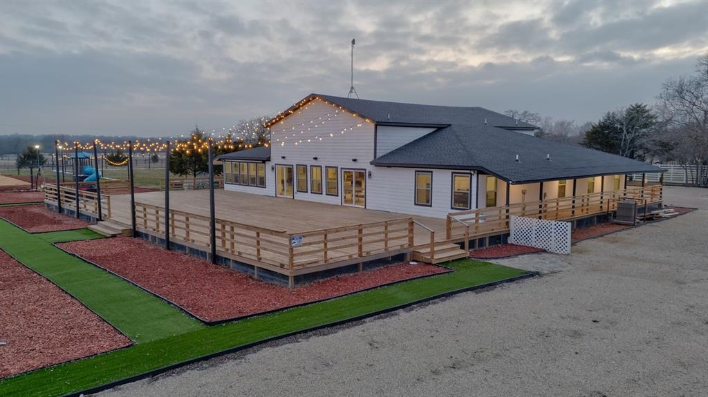 550 County Road 297 Gainesville, TX 76240 - Photo 14 of 24 a front view of a house with a yard table and chairs