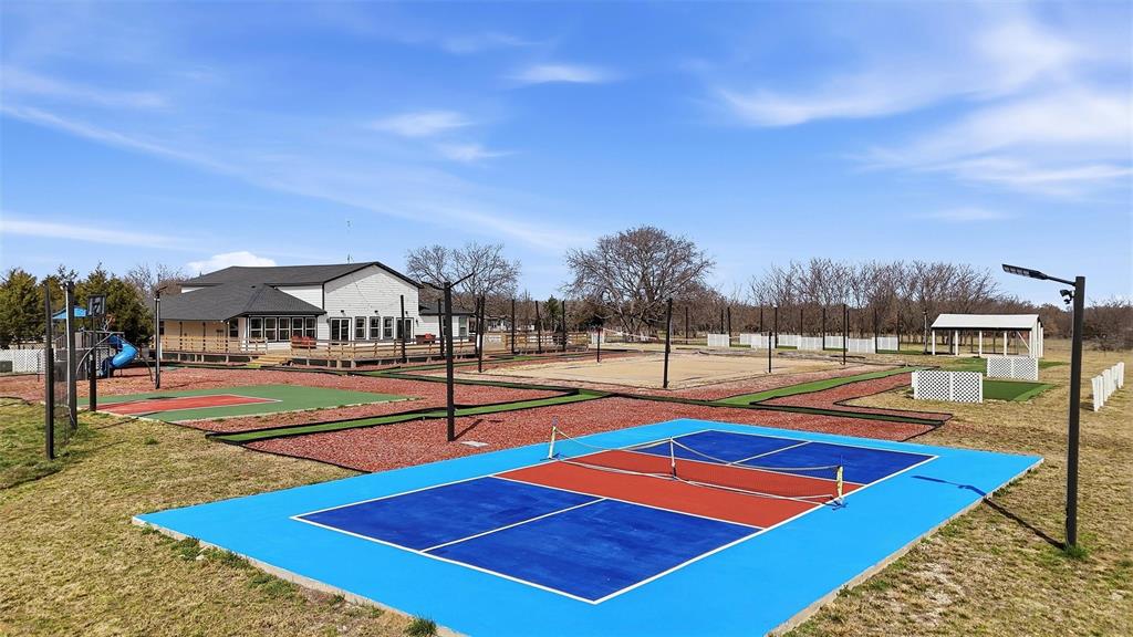 550 County Road 297 Gainesville, TX 76240 - Photo 16 of 40 a view of tennis court with houses
