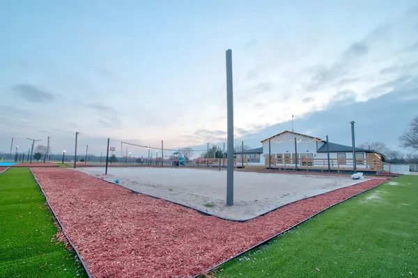 a childrens park with lots of swings and slides