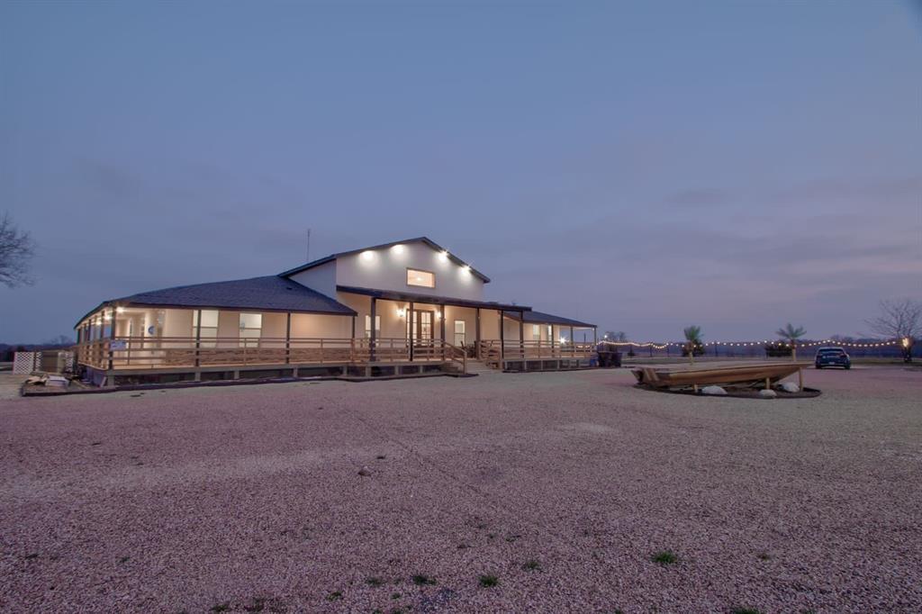 550 County Road 297 Gainesville, TX 76240 - Photo 19 of 24 a view of a house with a yard and sitting area