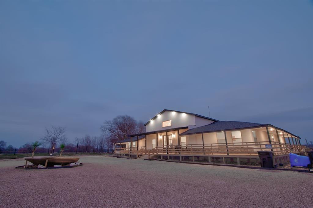 550 County Road 297 Gainesville, TX 76240 - Photo 20 of 24 a view of a car in front of a house