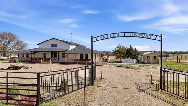 a view of a house with swimming pool and porch