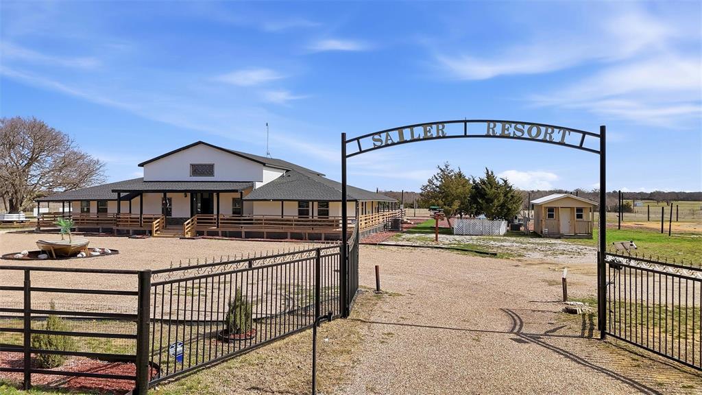 550 County Road 297 Gainesville, TX 76240 - Photo 2 of 40 a view of a house with wooden fence