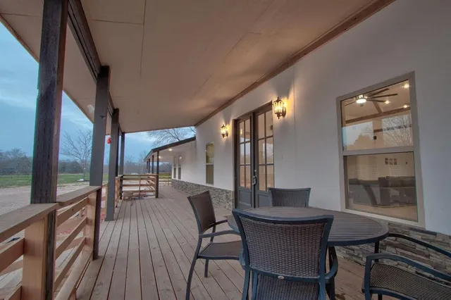 swimming pool view with a seating space
