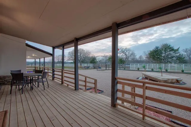 a view of a patio with wooden floor