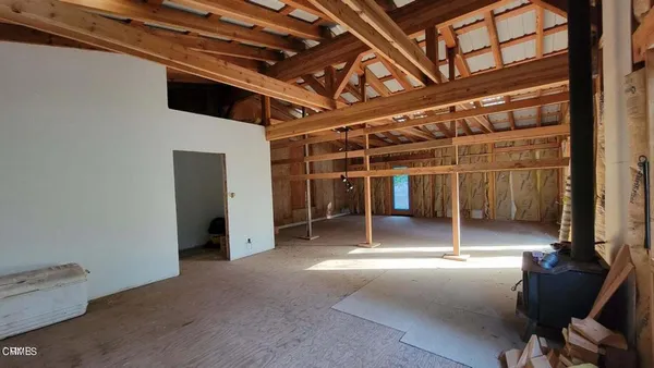 a view of a room with furniture and windows