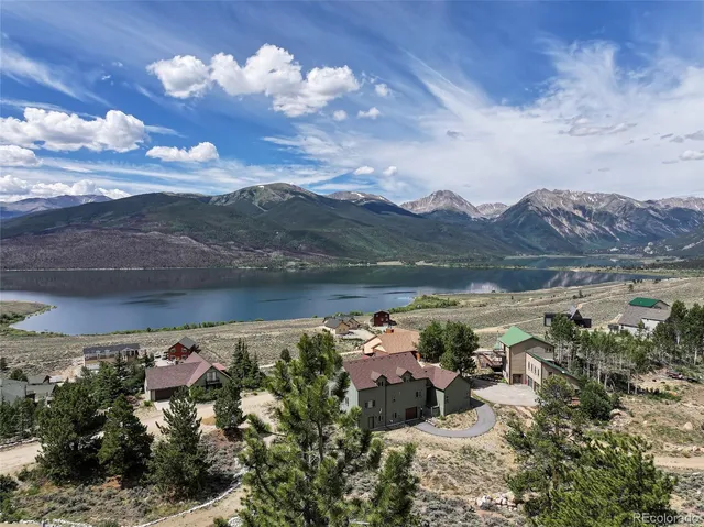 a view of a lake in middle of the forest