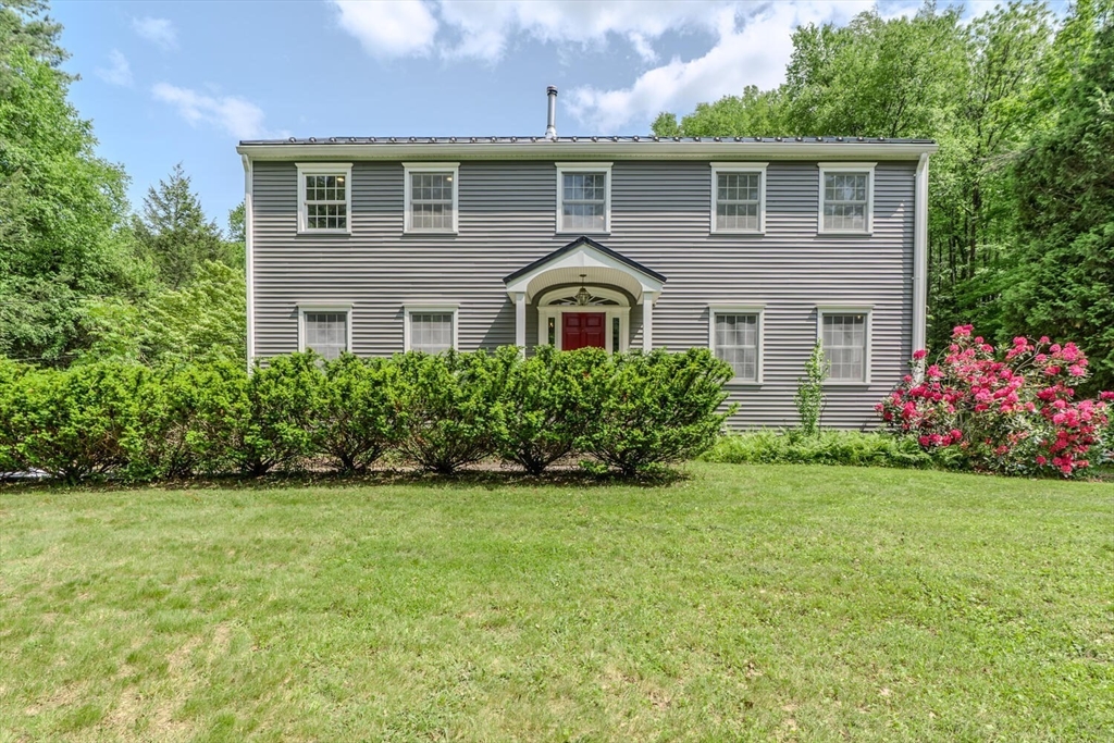 87 Montague Road Westhampton, MA 01027 - Photo 1 of 42 a front view of a house with a yard and garage
