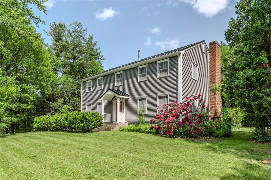 87 Montague Road Westhampton, MA 01027 - Photo 2 of 42 a front view of a house with a garden