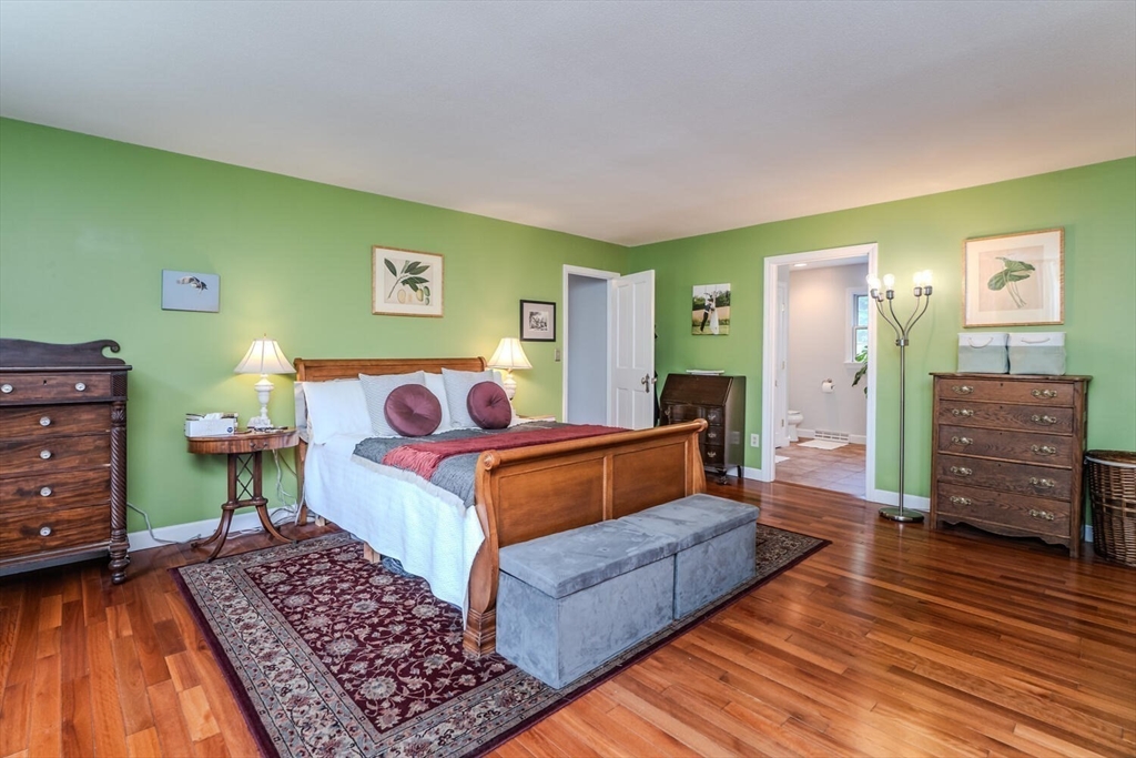 87 Montague Road Westhampton, MA 01027 - Photo 23 of 42 a bedroom with a bed and wooden floor
