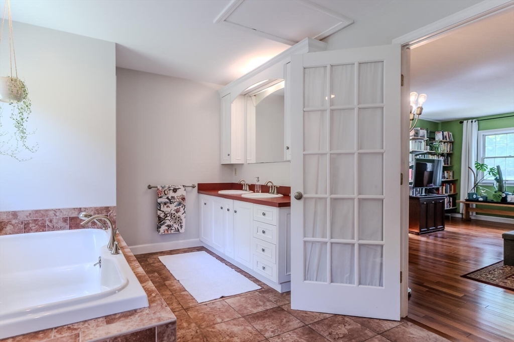 87 Montague Road Westhampton, MA 01027 - Photo 25 of 42 a bathroom with a bathtub and a sink