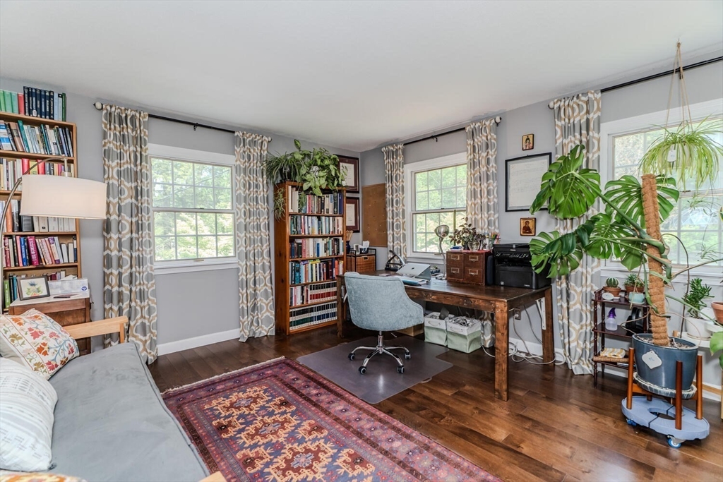 87 Montague Road Westhampton, MA 01027 - Photo 27 of 42 a living room with furniture and a potted plant