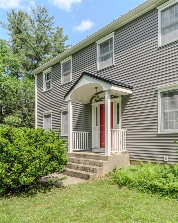 87 Montague Road Westhampton, MA 01027 - Photo 3 of 42 a front view of a house with a garden