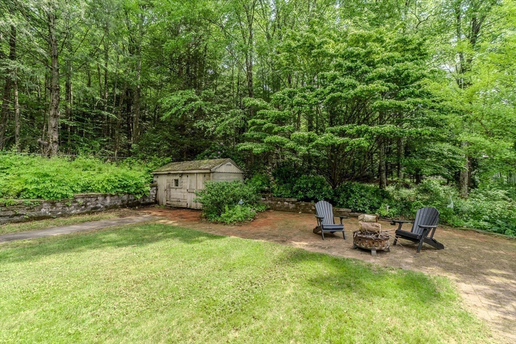 87 Montague Road Westhampton, MA 01027 - Photo 34 of 42 a backyard of a house with outdoor seating