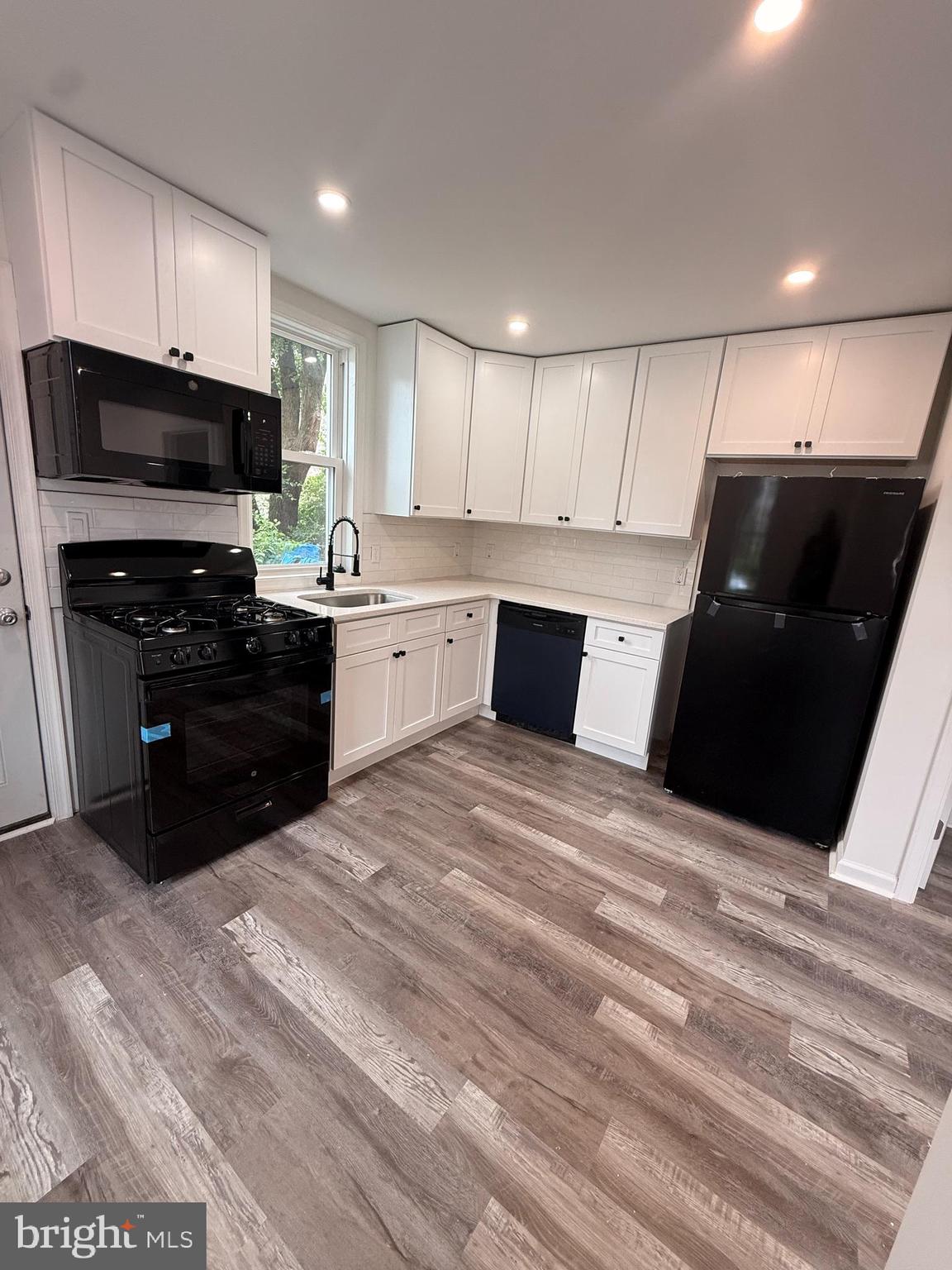 2124 Shields Street Philadelphia, PA 19142 - Photo 5 of 18 New kitchen with stove, d/w, microwave & refrige