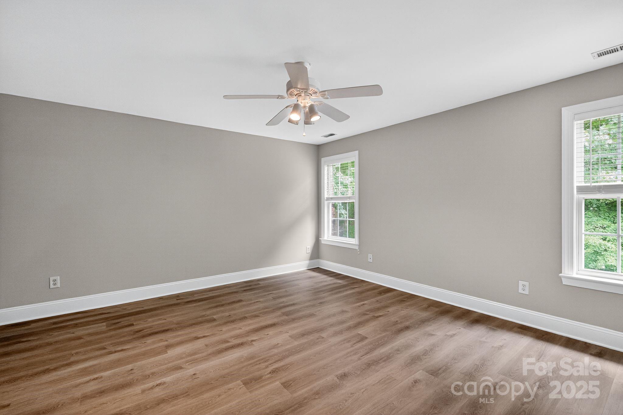 1000 Potters Bluff Road Monroe, NC 28110 - Photo 13 of 20 wooden floor in an empty room with a window