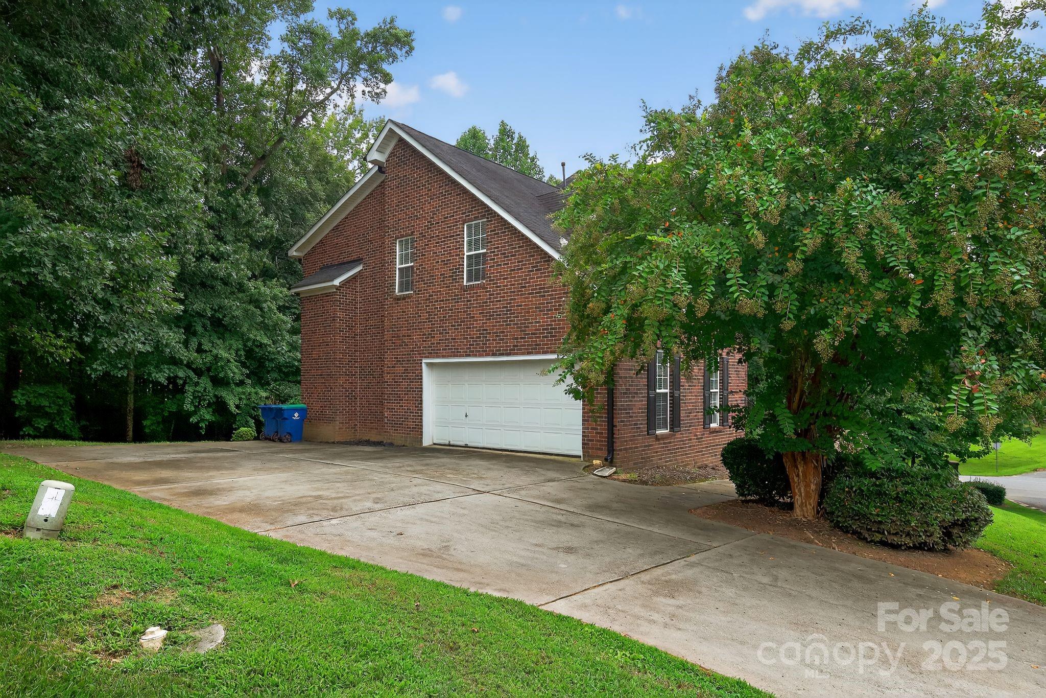 1000 Potters Bluff Road Monroe, NC 28110 - Photo 19 of 20 a front view of a house with a yard and garage