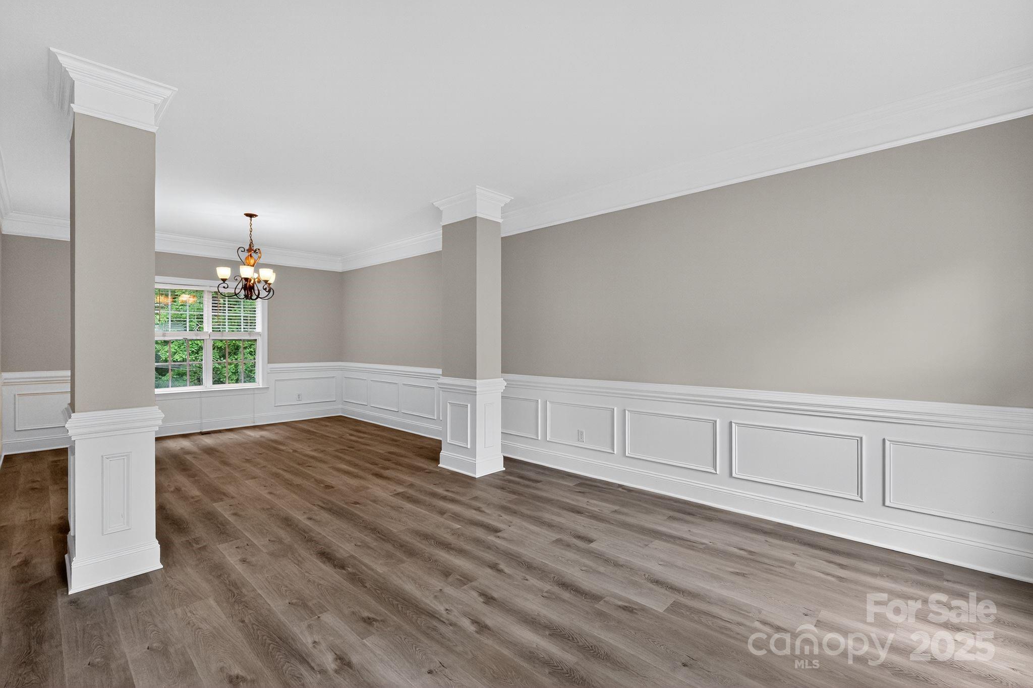 1000 Potters Bluff Road Monroe, NC 28110 - Photo 2 of 20 a view of empty room with wooden floor and fan