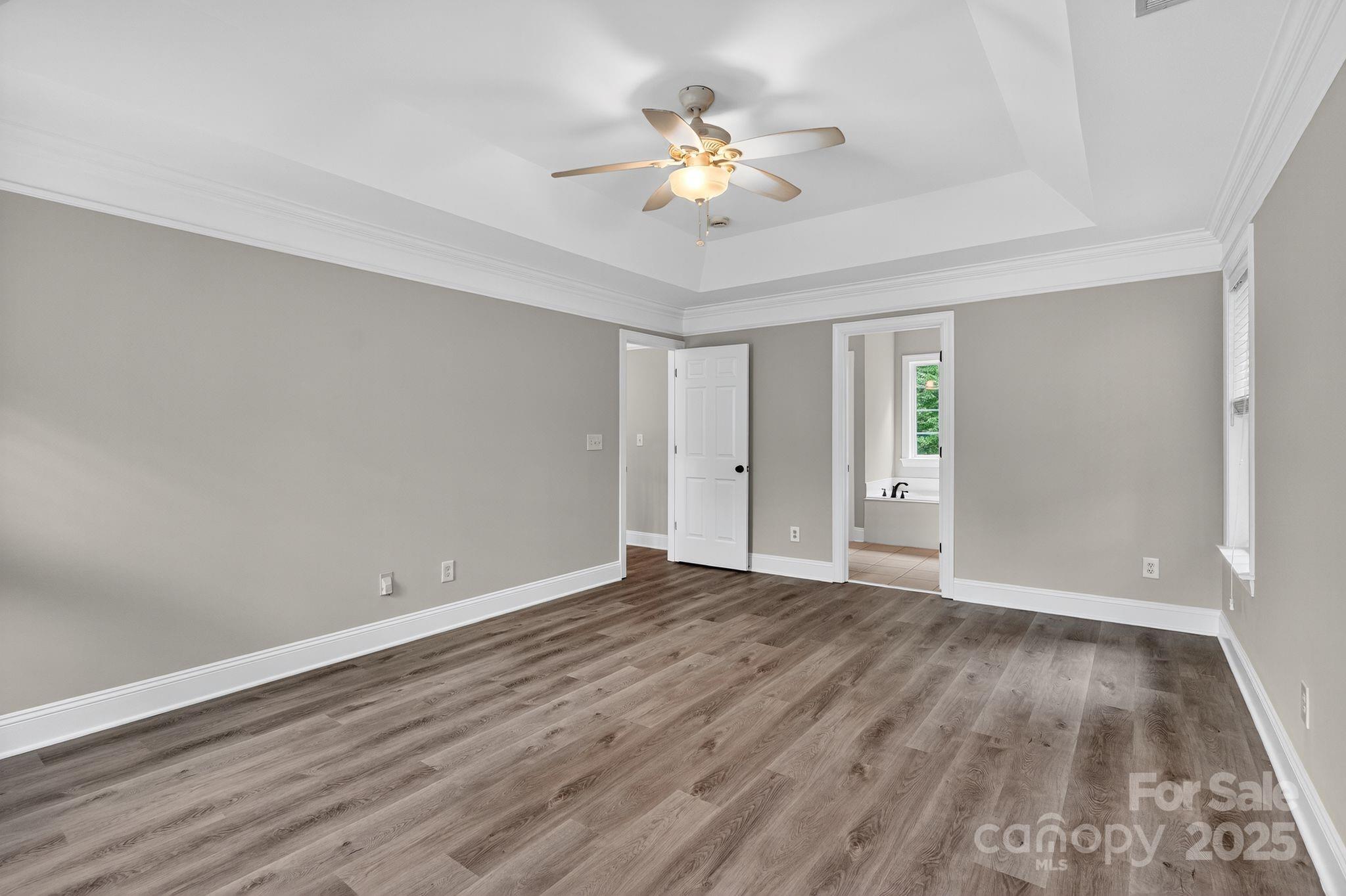 1000 Potters Bluff Road Monroe, NC 28110 - Photo 7 of 20 wooden floor in an empty room with a window